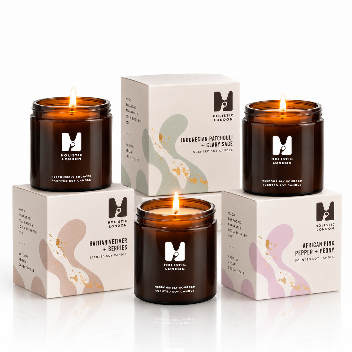 Holistic London Co wellbeing trio set of three amber glass soy candles with matching decorative gift boxes